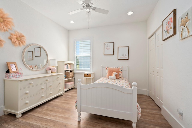709 SW Sun Cir, Palm City, FL 34990 - bedroom with light wood-style flooring, recessed lighting, a closet, and a ceiling fan