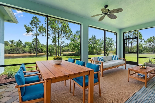 709 SW Sun Cir, Palm City, FL 34990 - sunroom / solarium featuring ceiling fan, a water view, an outdoor living space, and view of wooded area