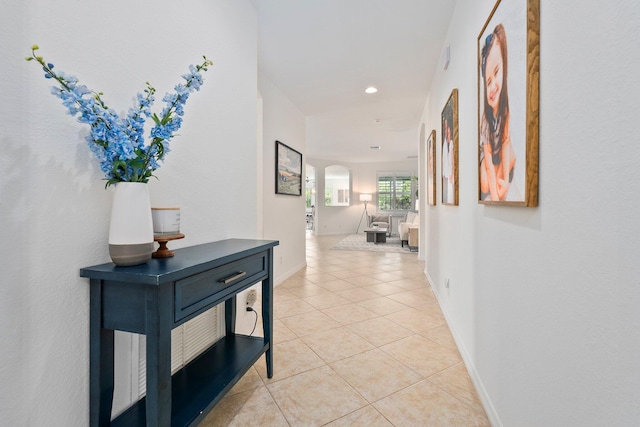709 SW Sun Cir, Palm City, FL 34990 - hallway with arched walkways, light tile patterned floors, and recessed lighting