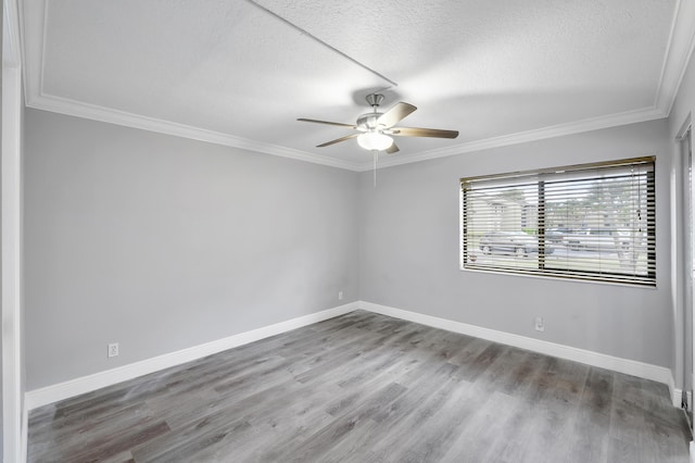 512 Shady Pine Way Unit B1, Greenacres, FL 33415 - unfurnished room featuring ceiling fan, wood finished floors, a textured ceiling, and ornamental molding