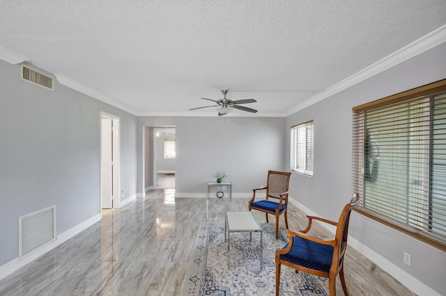512 Shady Pine Way Unit B1, Greenacres, FL 33415 - living area featuring wood finished floors, a textured ceiling, a ceiling fan, and crown molding