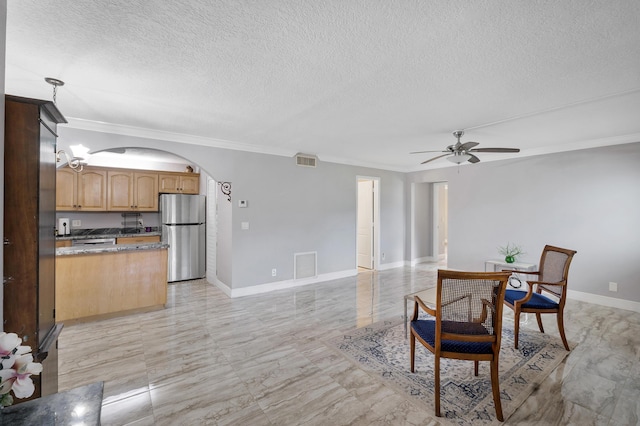 512 Shady Pine Way Unit B1, Greenacres, FL 33415 - dining space featuring arched walkways, a ceiling fan, a textured ceiling, and ornamental molding