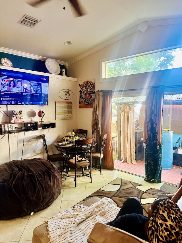 5200 Rising Comet Ln, Greenacres, FL 33463 - living area featuring tile patterned flooring, ceiling fan, crown molding, and lofted ceiling