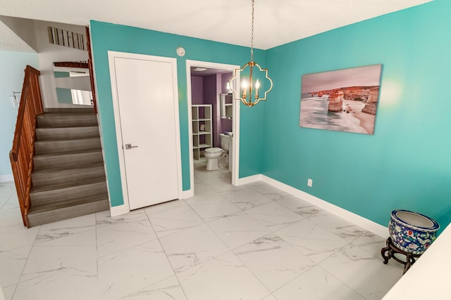 8129 Sedgewick Ct Unit 29-A, Lake Clarke Shores, FL 33406 - unfurnished dining area with a chandelier, stairway, and marble look tiles
