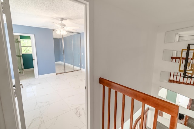 8129 Sedgewick Ct Unit 29-A, Lake Clarke Shores, FL 33406 - corridor featuring marble finish flooring and a textured ceiling