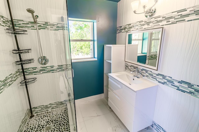 8129 Sedgewick Ct Unit 29-A, Lake Clarke Shores, FL 33406 - full bath featuring a stall shower, vanity, marble look tile flooring, and tasteful backsplash