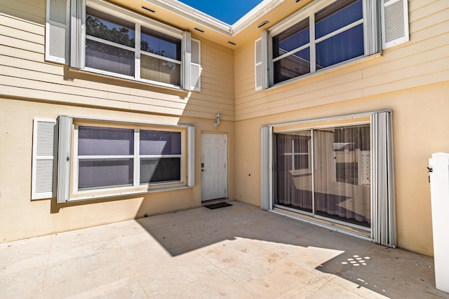 8129 Sedgewick Ct Unit 29-A, Lake Clarke Shores, FL 33406 - property entrance featuring a patio area and stucco siding