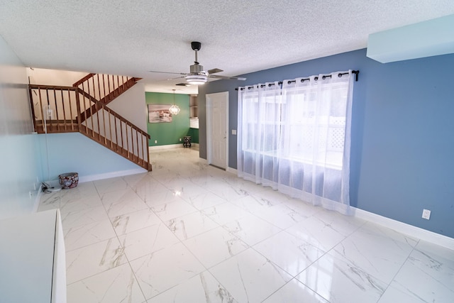 8129 Sedgewick Ct Unit 29-A, Lake Clarke Shores, FL 33406 - empty room featuring stairway, ceiling fan, marble finish flooring, and a textured ceiling