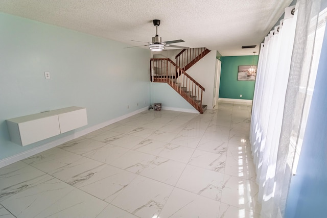 8129 Sedgewick Ct Unit 29-A, Lake Clarke Shores, FL 33406 - unfurnished living room featuring stairs, a ceiling fan, and a textured ceiling