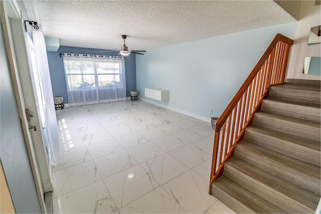 8129 Sedgewick Ct Unit 29-A, Lake Clarke Shores, FL 33406 - unfurnished room with marble finish floors, stairway, a textured ceiling, and a ceiling fan