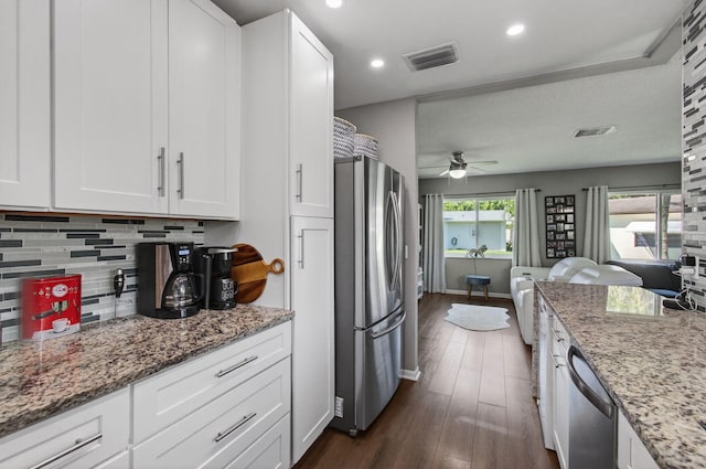 2520 SW Natura Blvd, Deerfield Beach, FL 33441 - kitchen featuring stainless steel appliances, white cabinets, a ceiling fan, tasteful backsplash, and recessed lighting