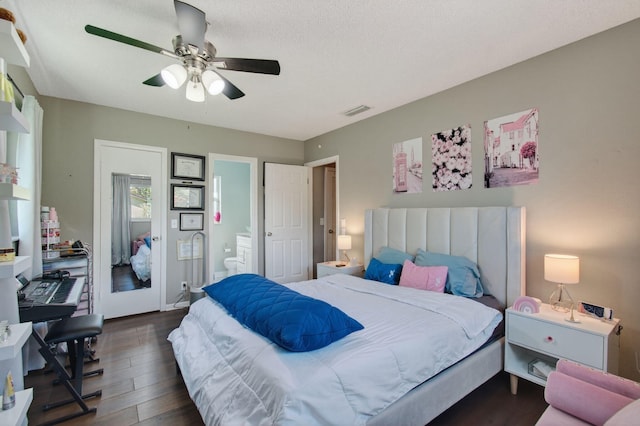 2520 SW Natura Blvd, Deerfield Beach, FL 33441 - bedroom featuring dark wood finished floors, connected bathroom, and a ceiling fan