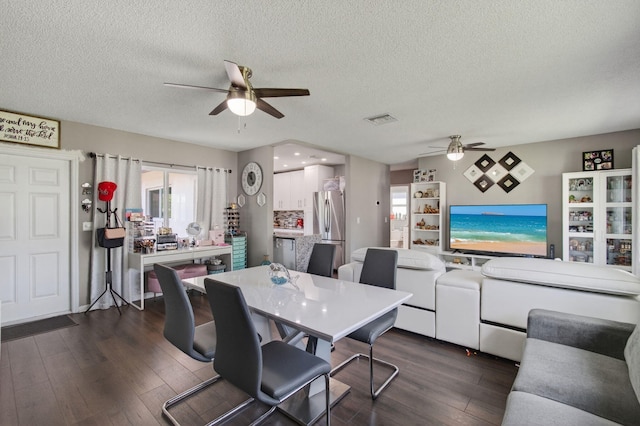 2520 SW Natura Blvd, Deerfield Beach, FL 33441 - dining room featuring ceiling fan, a textured ceiling, and dark wood-style floors