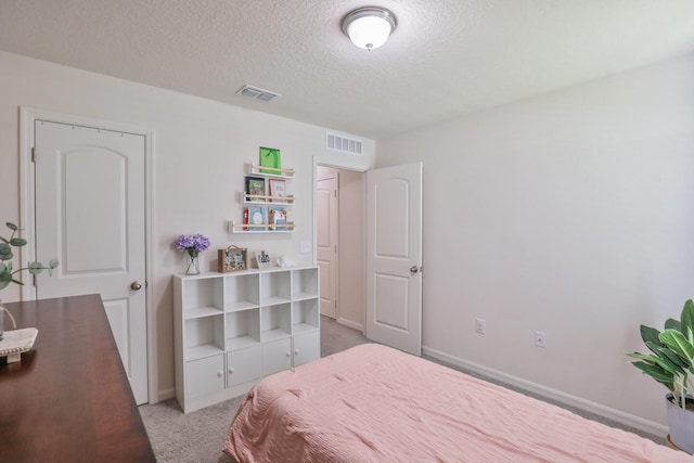 1937 SW Aguero St, Port Saint Lucie, FL 34953 - carpeted bedroom featuring a textured ceiling and baseboards