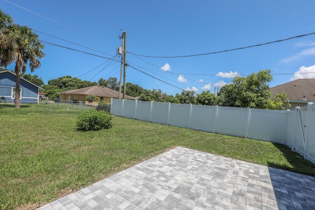 1937 SW Aguero St, Port Saint Lucie, FL 34953 - fenced backyard with a patio