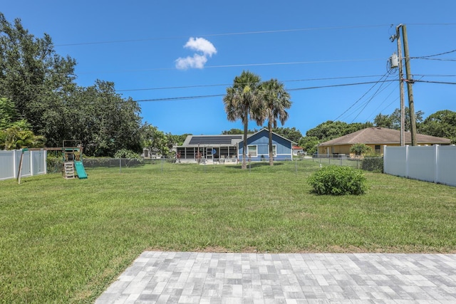 1937 SW Aguero St, Port Saint Lucie, FL 34953 - fenced backyard with a playground