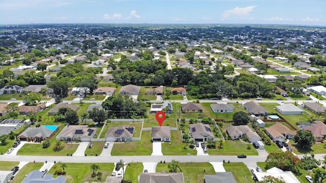 1937 SW Aguero St, Port Saint Lucie, FL 34953 - aerial view of property and surrounding area featuring nearby suburban area