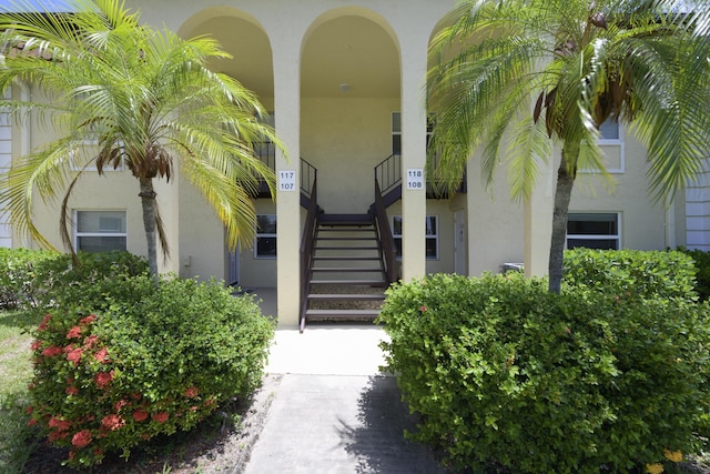717 S US Highway 1 Unit 108, Jupiter, FL 33477 - doorway to property with stucco siding