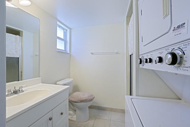 717 S US Highway 1 Unit 108, Jupiter, FL 33477 - full bathroom with stacked washing machine and dryer, tile patterned floors, vanity, and a shower