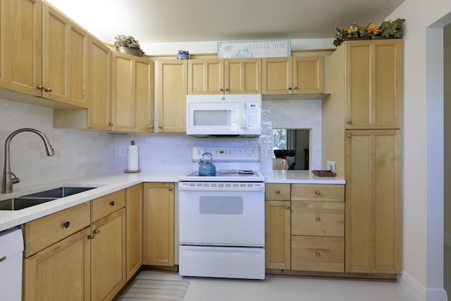 717 S US Highway 1 Unit 108, Jupiter, FL 33477 - kitchen with white appliances, light brown cabinets, and tasteful backsplash