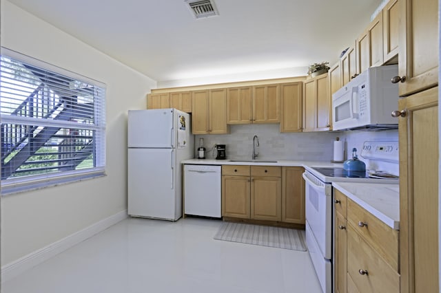 717 S US Highway 1 Unit 108, Jupiter, FL 33477 - kitchen with white appliances, light brown cabinets, and light countertops