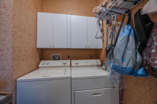 10856 Royal Caribbean Cir, Boynton Beach, FL 33437 - laundry area featuring cabinet space, washing machine and clothes dryer, and wallpapered walls
