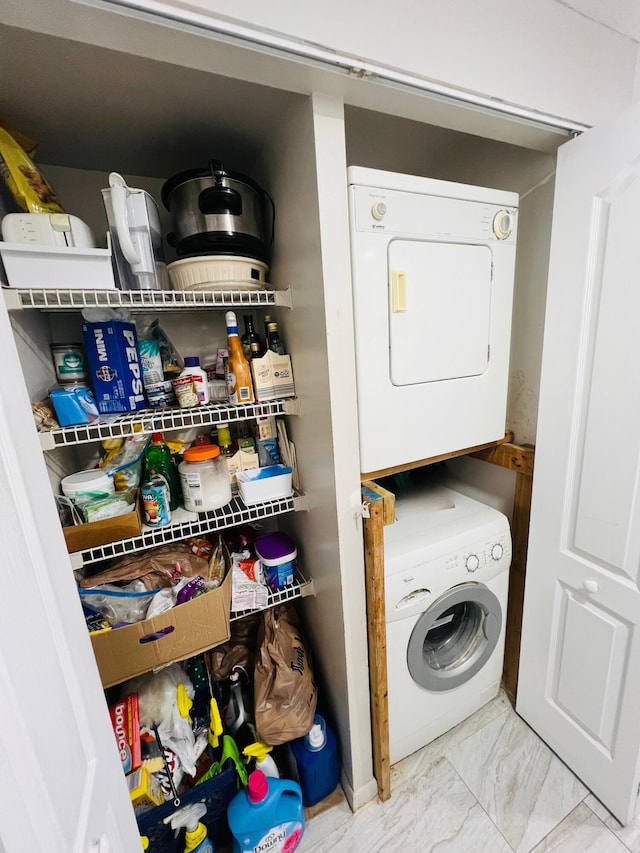 10145 NW 9th St Cir Unit 7-106, Miami, FL 33172 - laundry area with stacked washer / drying machine and marble finish floors