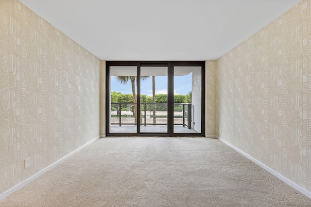 3440 S Ocean Blvd Unit 107S, Palm Beach, FL 33480 - unfurnished room featuring wallpapered walls and carpet