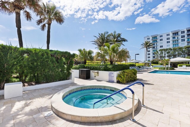 3440 S Ocean Blvd Unit 107S, Palm Beach, FL 33480 - community pool featuring a community hot tub and a patio