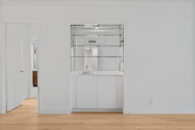 3440 S Ocean Blvd Unit 107S, Palm Beach, FL 33480 - detailed view of wood finished floors and bar with sink