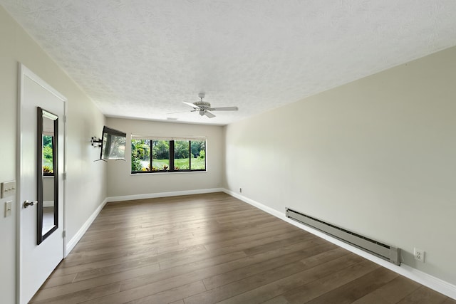 13116 SE Point O Woods Ct, Hobe Sound, FL 33455 - unfurnished room featuring a baseboard heating unit, a textured ceiling, wood finished floors, and a ceiling fan
