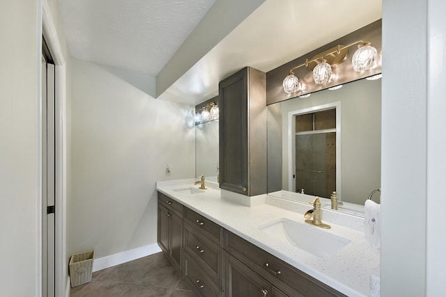 13116 SE Point O Woods Ct, Hobe Sound, FL 33455 - bathroom featuring double vanity, a shower stall, and tile patterned floors