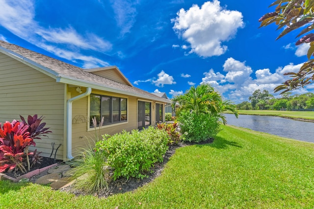 13116 SE Point O Woods Ct, Hobe Sound, FL 33455 - view of green lawn with a water view