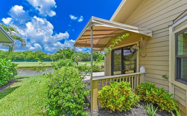 13116 SE Point O Woods Ct, Hobe Sound, FL 33455 - view of grassy yard with a water view