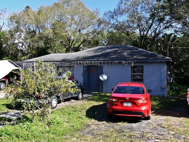 1808 N 50th St, Fort Pierce, FL 34947 - view of front facade with a shingled roof