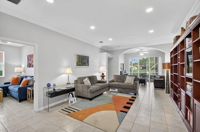 10853 Royal Caribbean Cir, Boynton Beach, FL 33437 - living room featuring arched walkways, recessed lighting, crown molding, and light tile patterned flooring