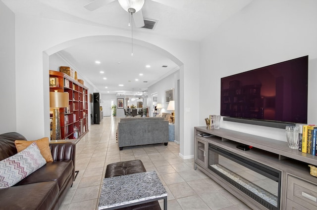 10853 Royal Caribbean Cir, Boynton Beach, FL 33437 - living area with arched walkways, a ceiling fan, light tile patterned floors, recessed lighting, and crown molding