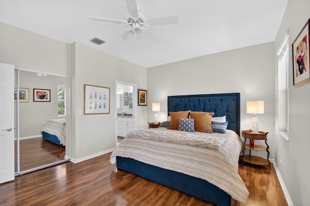 10853 Royal Caribbean Cir, Boynton Beach, FL 33437 - bedroom with wood finished floors, ceiling fan, and connected bathroom
