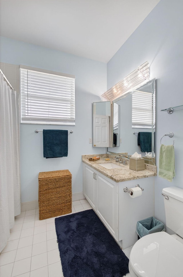 10853 Royal Caribbean Cir, Boynton Beach, FL 33437 - bathroom featuring vanity, healthy amount of natural light, tile patterned floors, and a shower with curtain