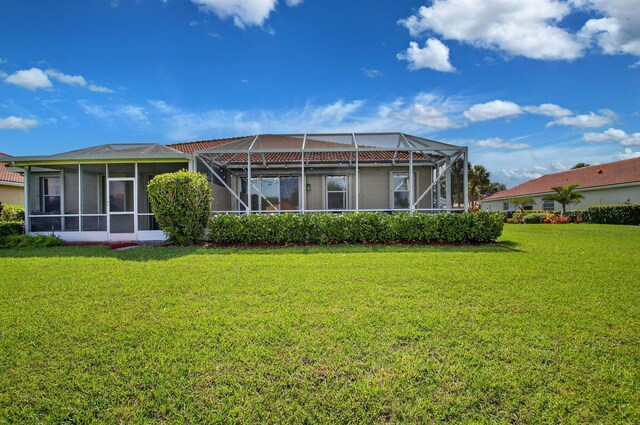 10853 Royal Caribbean Cir, Boynton Beach, FL 33437 - rear view of house with a yard and glass enclosure