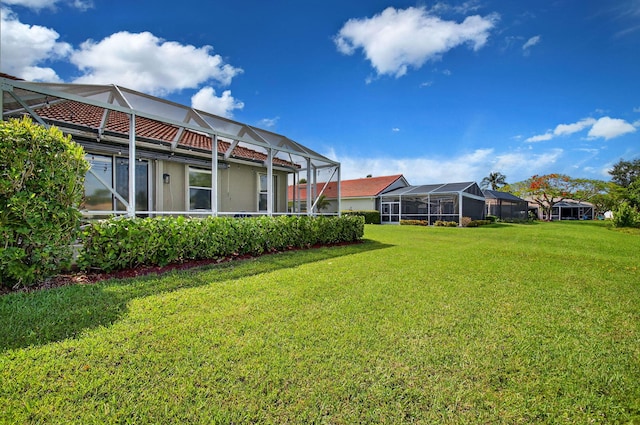 10853 Royal Caribbean Cir, Boynton Beach, FL 33437 - view of green lawn with a lanai