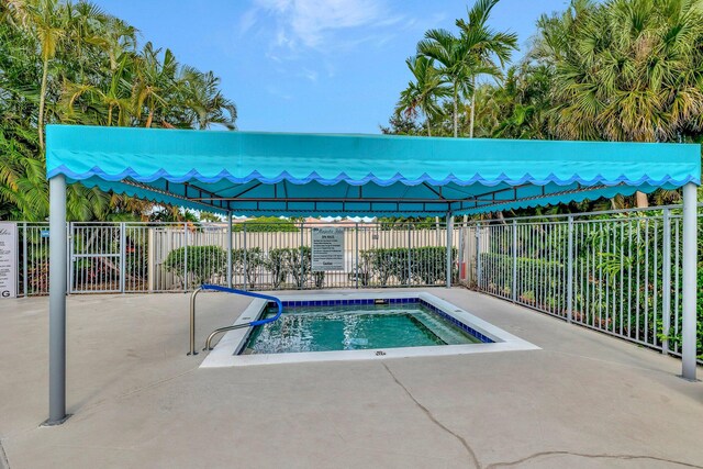 10853 Royal Caribbean Cir, Boynton Beach, FL 33437 - view of pool with a hot tub