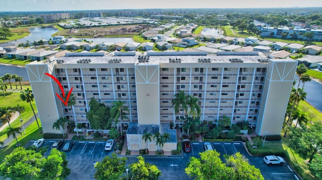 7260 Kinghurst Dr Unit 401, Delray Beach, FL 33446 - drone / aerial view of apartment complex / building and a nearby body of water