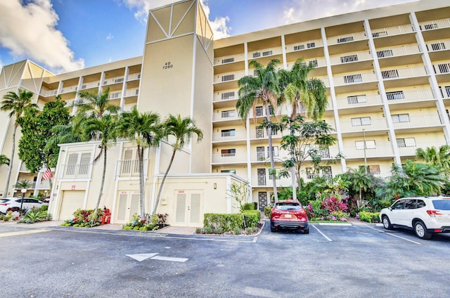 7260 Kinghurst Dr Unit 401, Delray Beach, FL 33446 - view of apartment building / complex featuring uncovered parking