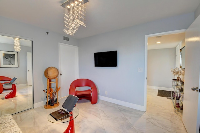 7260 Kinghurst Dr Unit 401, Delray Beach, FL 33446 - sitting room featuring a chandelier and marble finish flooring