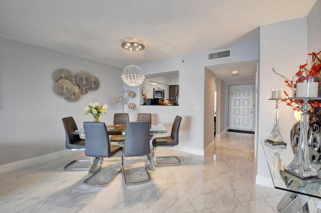 7260 Kinghurst Dr Unit 401, Delray Beach, FL 33446 - dining area featuring light marble finish flooring and baseboards