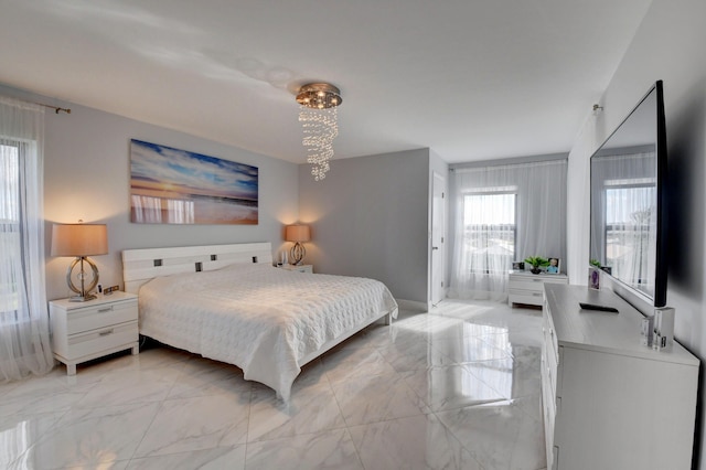 7260 Kinghurst Dr Unit 401, Delray Beach, FL 33446 - bedroom with light marble finish floors and a chandelier