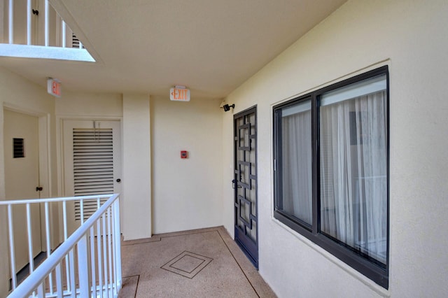 7260 Kinghurst Dr Unit 401, Delray Beach, FL 33446 - property entrance featuring stucco siding
