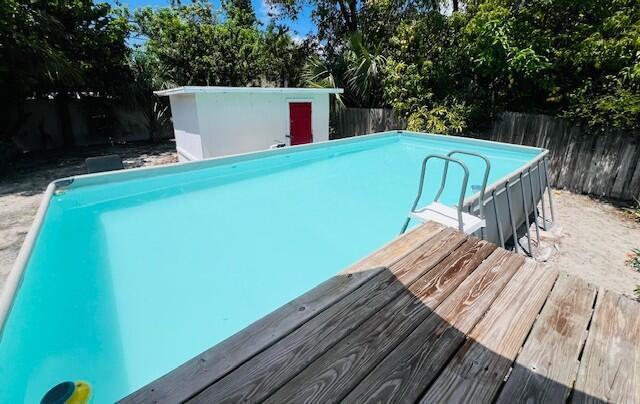 181 NE 15th Ter, Boca Raton, FL 33432 - view of pool featuring a fenced backyard