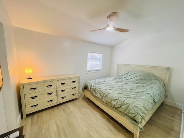 181 NE 15th Ter, Boca Raton, FL 33432 - bedroom with light wood finished floors, lofted ceiling, and ceiling fan
